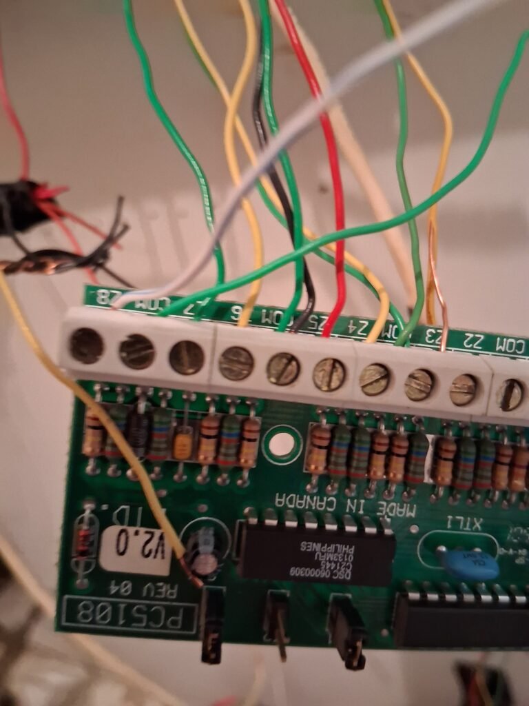 DSC access control and alarm panel field wiring found during an Ottawa commercial site review